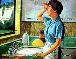 A woman in the kitchen, near the sink area